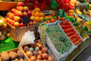 boxes of fresh fruits and vegetables in the market